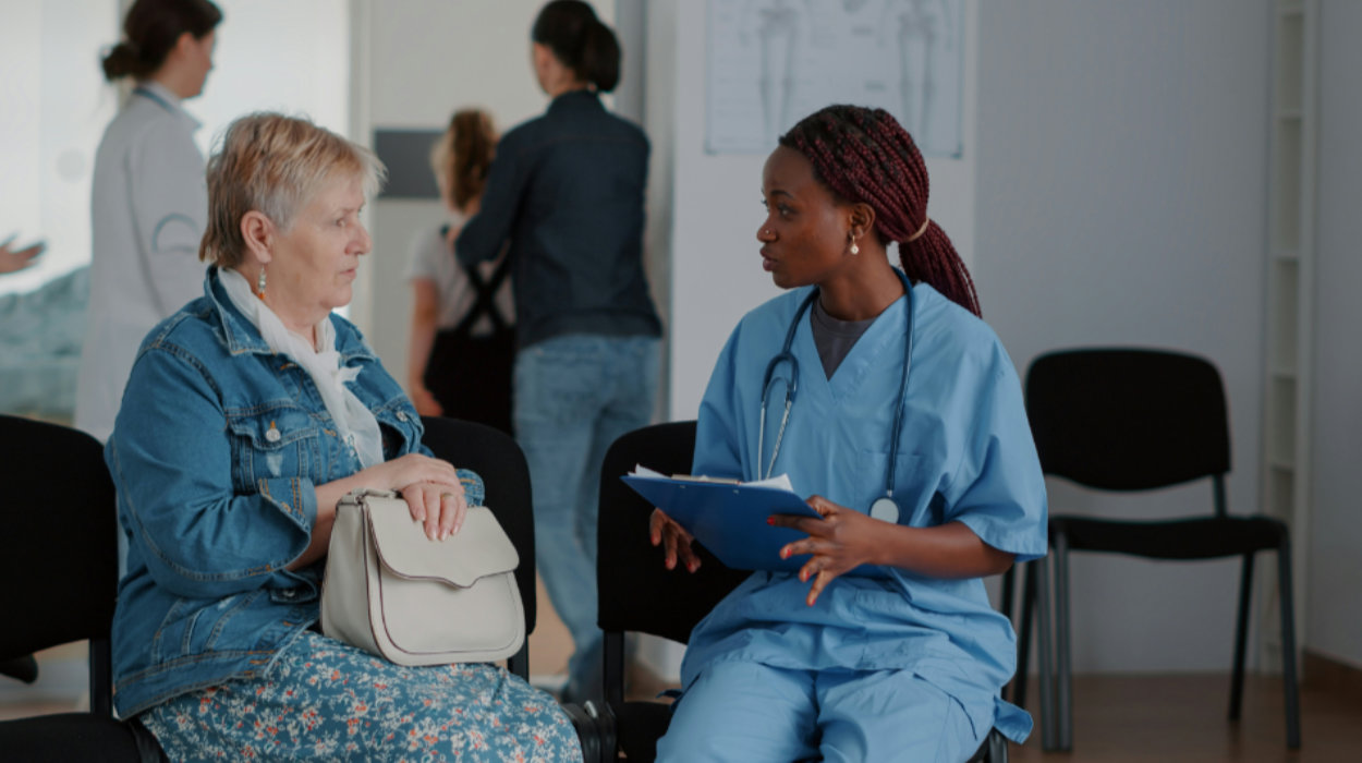 nurse and patient talking in a waiting room