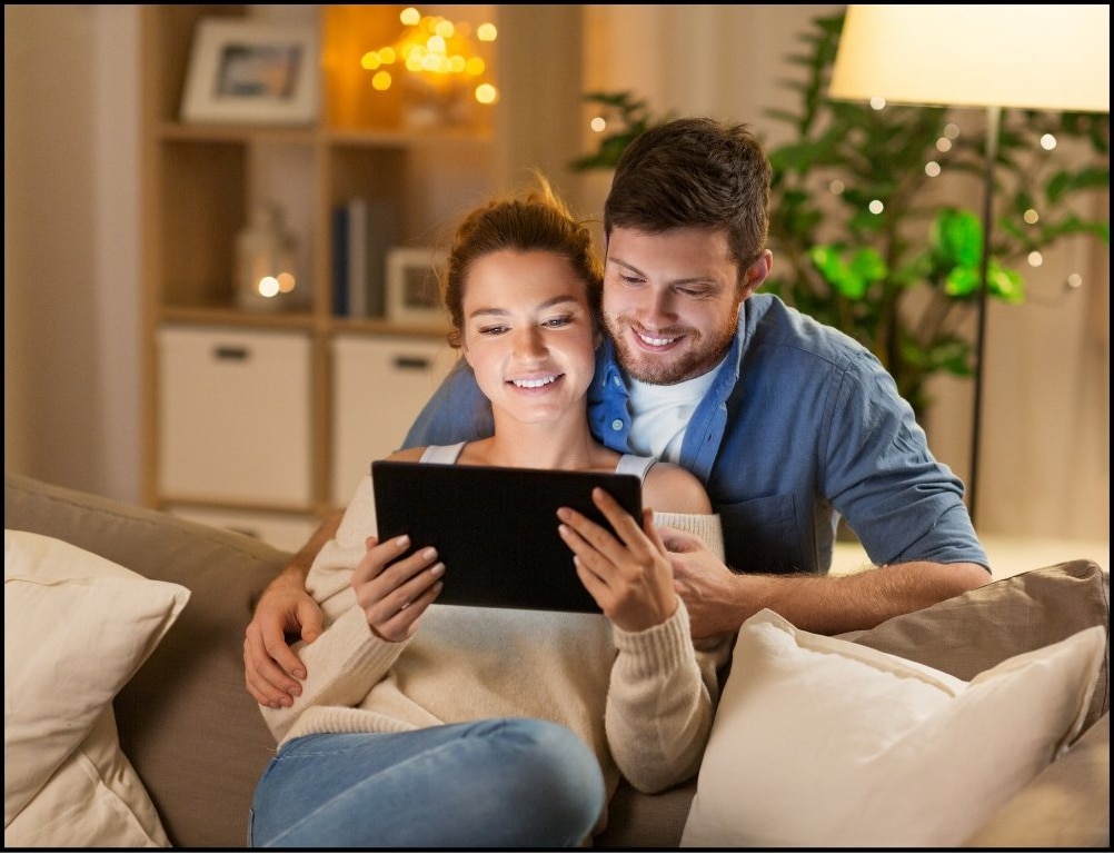 Couple watching streaming content on a tablet at home